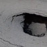 В Воронеже на улице Куколкина появился провал в асфальте после недельного потопа